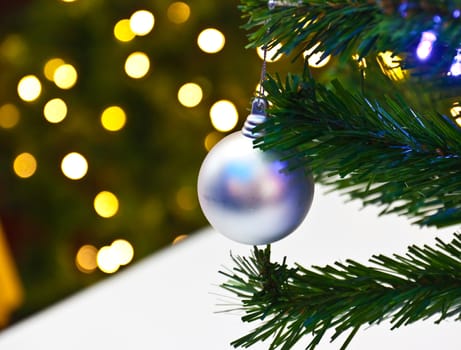 Background image of a Christmas tree decorated with lights