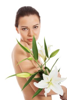 Beautiful topless woman with white lily. Isolated on white.