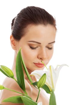 Beautiful topless woman with white lily. Isolated on white.