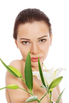 Beautiful topless woman with white lily. Isolated on white.