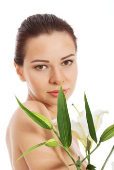 Beautiful topless woman with white lily. Isolated on white.