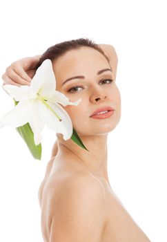 Beautiful topless woman with white lily. Isolated on white.