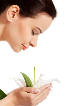 Beautiful woman holding lily flower. Isolated on white.
