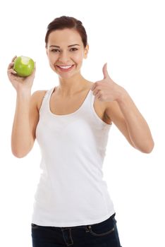 Beautiful woman holding an apple, showing OK. Isolated on white.