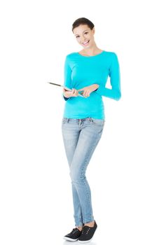 beautiful casual woman holding a tablet. Isolated on white.