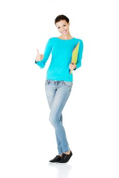 beautiful casual woman holding files and showing OK. Isolated on white.