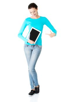 beautiful casual woman holding a tablet. Isolated on white.