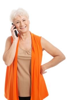 An old woman talking through phone. Isolated on white.