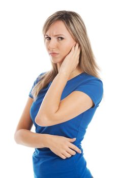 Young casual woman touching her ear. Isolated on white.