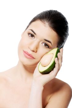 Beautiful woman holding avocado. Isolated on white.