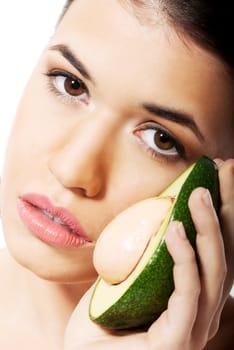 Beautiful woman holding avocado. Isolated on white.