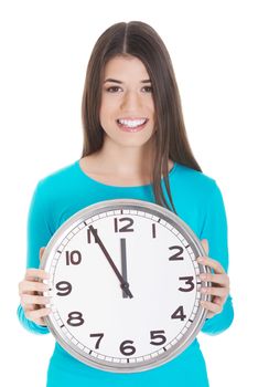 Young casual woman is holding a clock. Isolated on white.