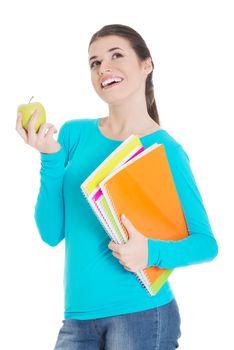 Beautiful young student with files and apple. Isolated on white.