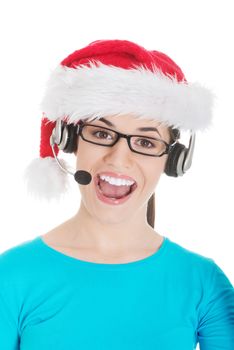 Young casual woman in santa hat and,microphone and headphones. Isolated on white.