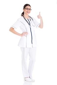 Young beautiful doctor, nurse with stethoscope showing ok. Isolated on white.