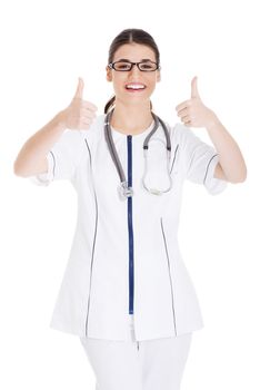 Young beautiful doctor, nurse with stethoscope showing ok. Isolated on white.