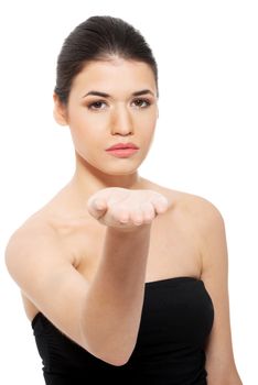 Portrait of beautiful woman in black top with her hand in front. Isolated on white.