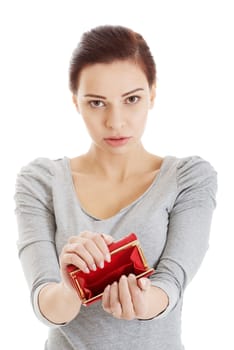 Beautiful casual woman showing her empty wallet. Isolated on white.