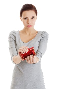 Beautiful casual woman showing her empty wallet. Isolated on white.