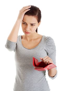 Beautiful casual woman with empty wallet, worrying. Isolated on white.