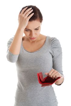 Beautiful casual woman with empty wallet, worrying. Isolated on white.