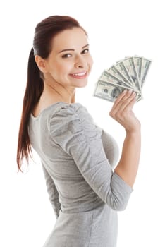 Beatiful casual woman holding money. Isolated on white.