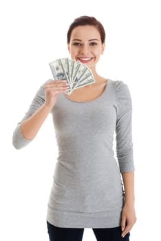 Beatiful casual woman holding money. Isolated on white.