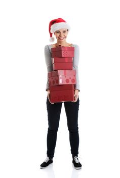 Beautifull woman in santa hat holding presents. Isolated on white.