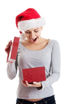 Beautiful woman in santa hat and opening present in a box. Isolated on white.