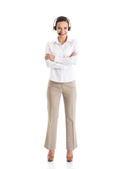 Beautiful woman standing with microphone and headphones. Isolated on white.