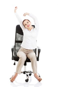 Beautiful business woman sitting and relaxing on a chair. Isolated on white.