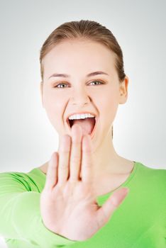 Hold on, Stop gesture showed by young woman