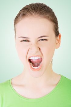 Young casual woman screaming with anger