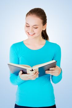 Young woman reading an old book