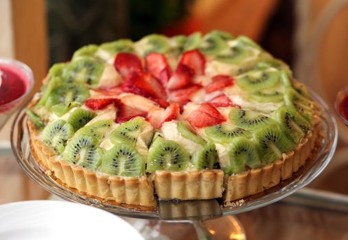 Fruit cake with strawberries and kiwi
