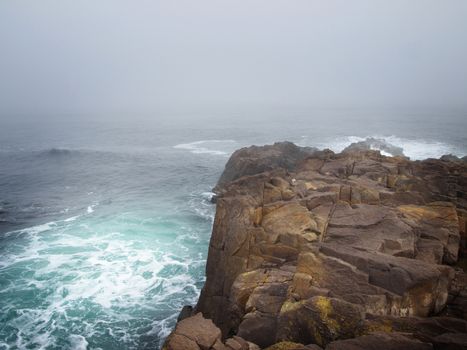 Storm Sea With Dark Rocks in Bad Weather Time