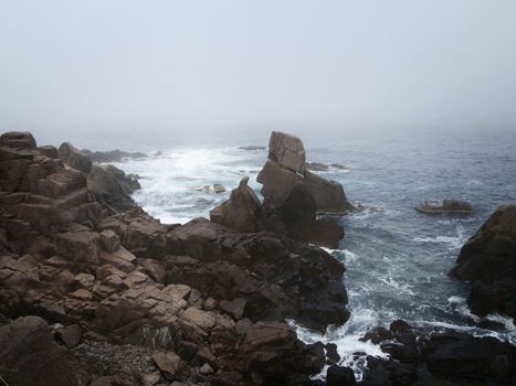 Storm Sea With Dark Rocks in Bad Weather Time