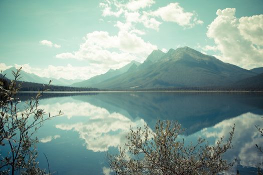 mountains clouds and sky; water reflection