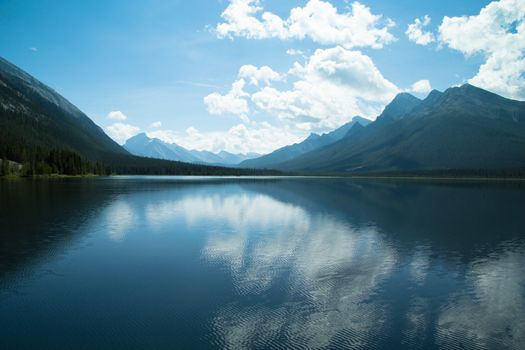 mountains clouds and sky; water reflection