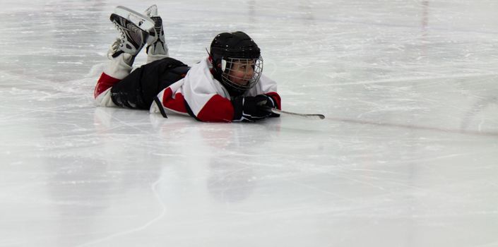 Child playing ice hockey