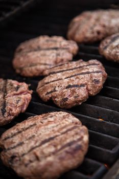 Hamburgers cooking on the BBQ grill