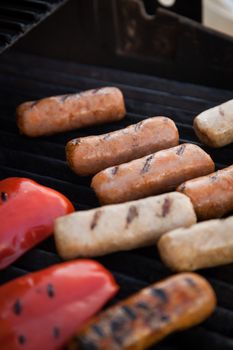 Sausages and red peper on the BBQ grill