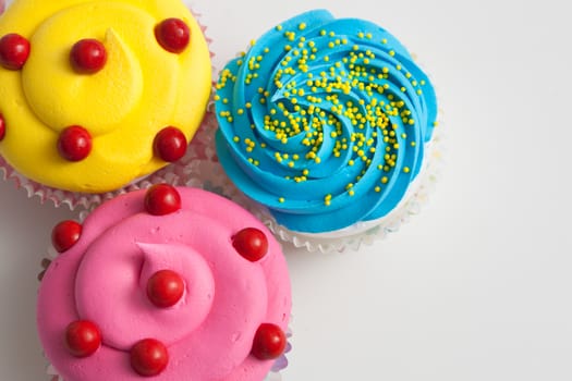 Colorful decorated cupcakes closeup