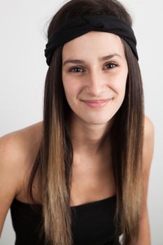 Young caucasian brunette woman on a white background