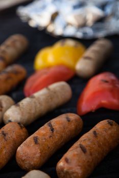 Sausages and red peper on the BBQ grill