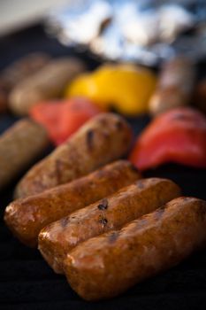 Sausages and red peper on the BBQ grill