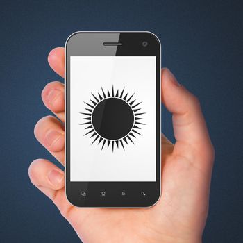 Travel concept: hand holding smartphone with Sun on display. Mobile smart phone on Blue background, 3d render