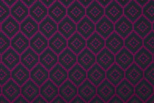 Material in geometric patterns, a colored textile background.