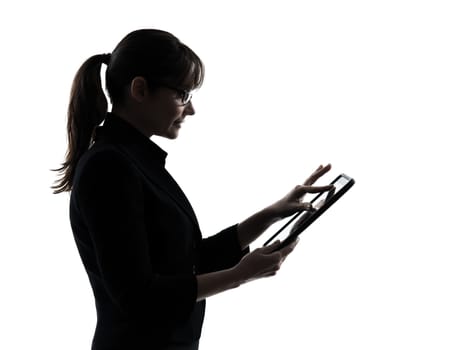 one business woman computer computing typing digital tablet silhouette studio isolated on white background