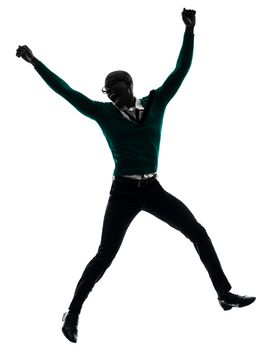 one african black man jumping happy in silhouette studio on white background